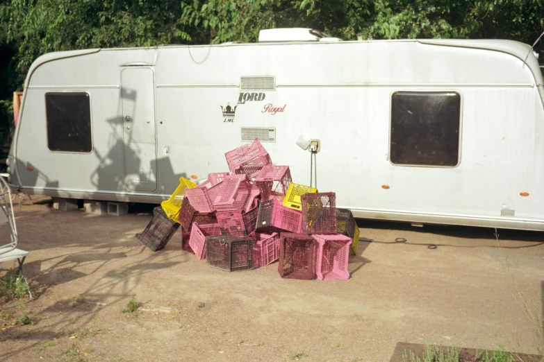 a trailer parked with several boxes outside