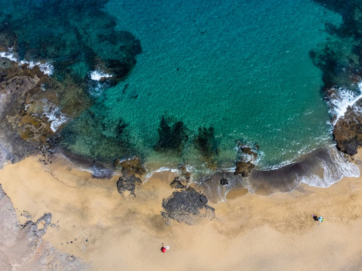 aerial view of beach area with clear waters