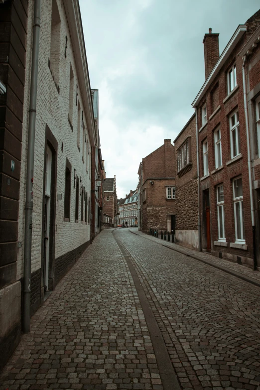 a brick street lined with lots of brick buildings