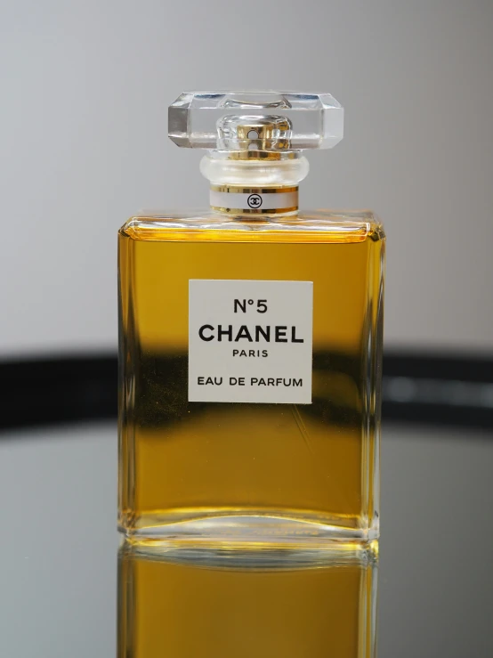 an unboxed chanel bottle sitting on a table