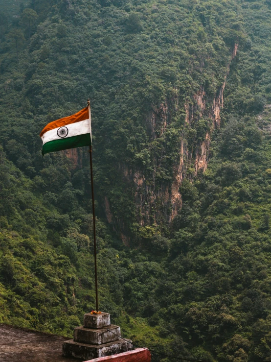 the flag is flown at half mast on a cliff