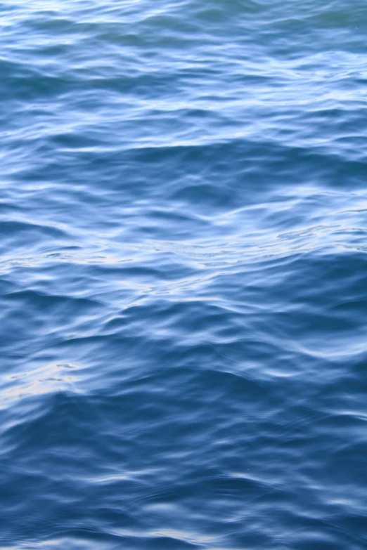 a long line of white lines across a body of water