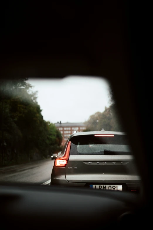 a view from inside a car with the rear light on