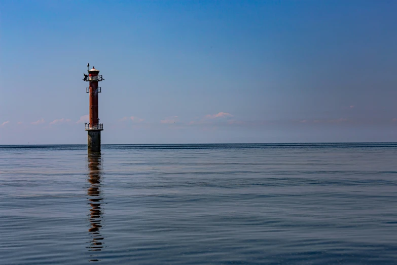 an ocean with a water tower on top