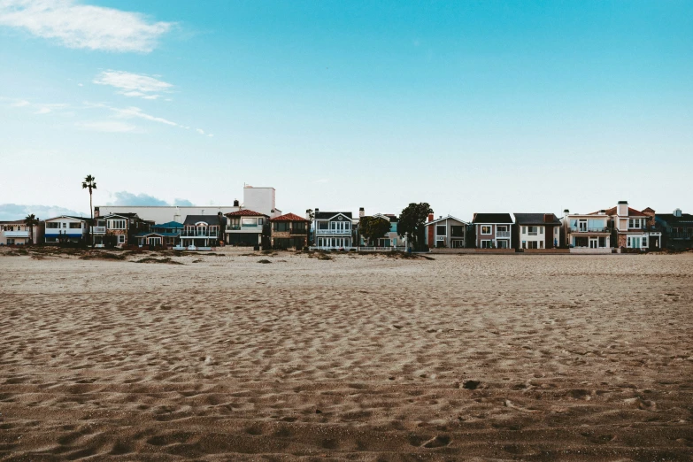 a large open area covered in sand on a clear day