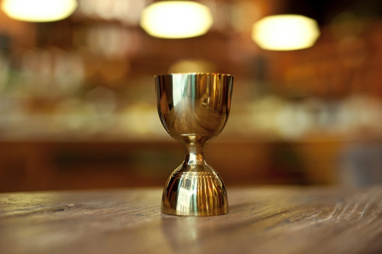 a closeup of a small golden cup