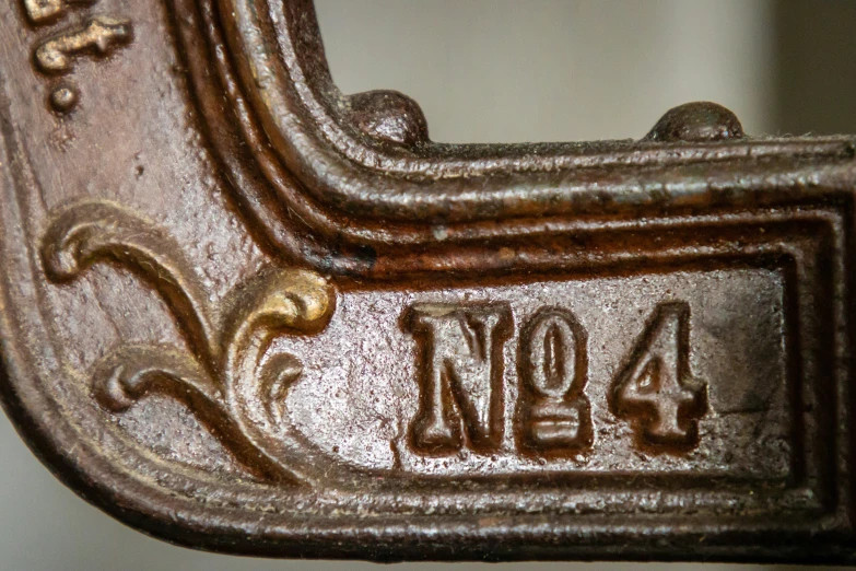 an antique metal chair with the number forty four on it