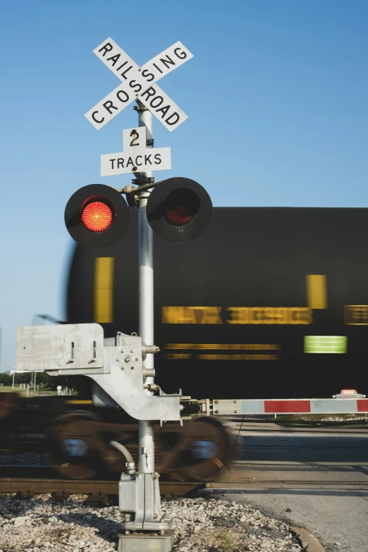 a train is crossing over tracks on a railroad crossing