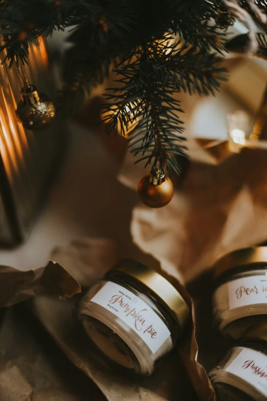 a small evergreen tree is decorated with jars