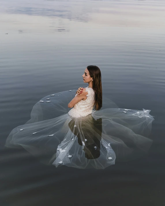 a woman wearing a sheer skirt in the water