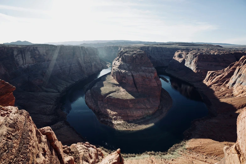 the landscape has many rocks and water in it