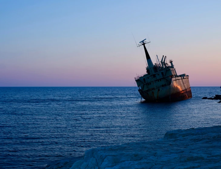 the big ship is sitting still out in the ocean