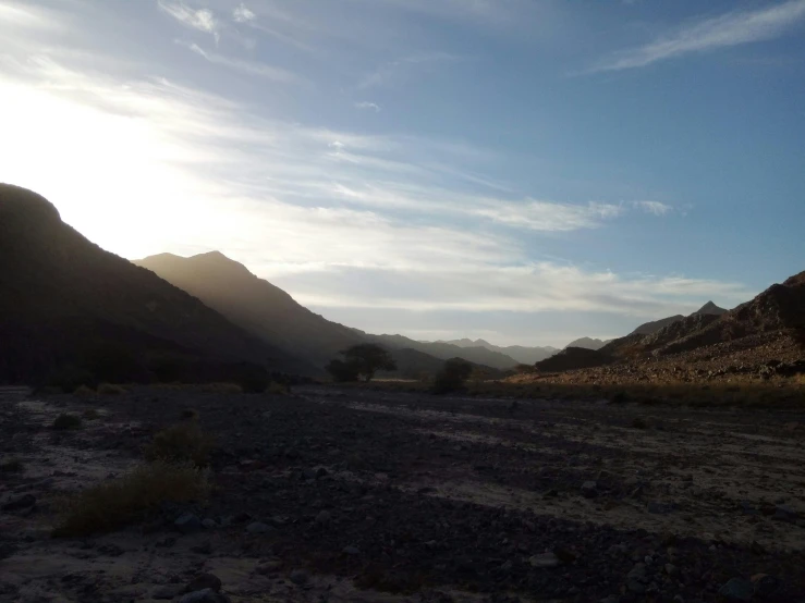 the sky is clear and blue above some hills