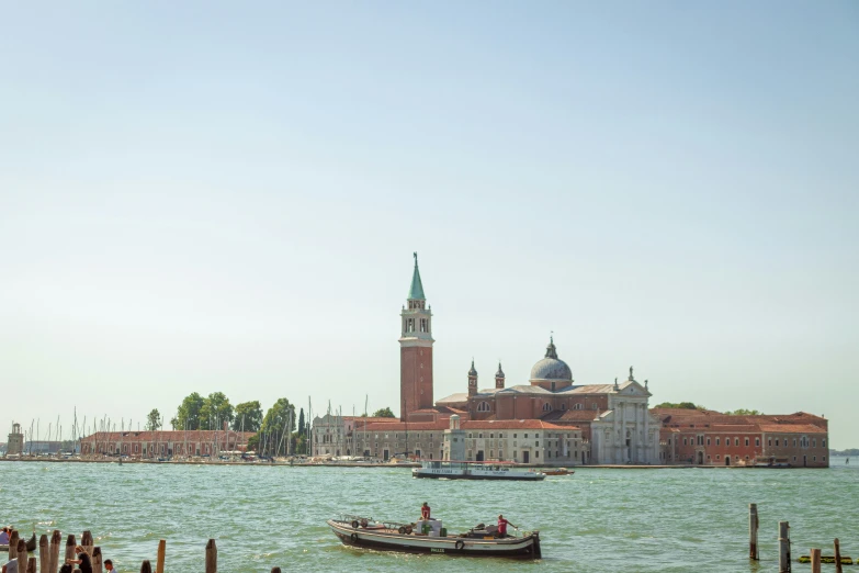 people are in boats and a small boat in the water