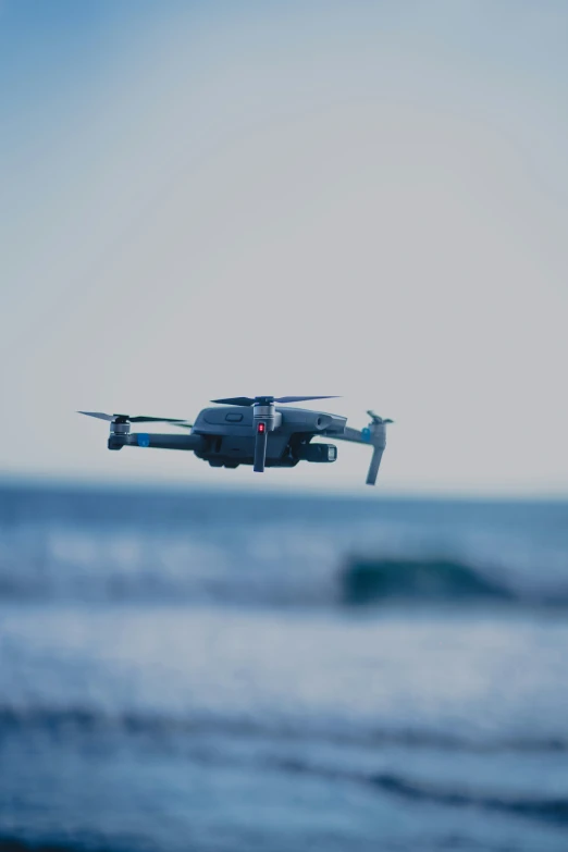 a small aircraft flying low over the water