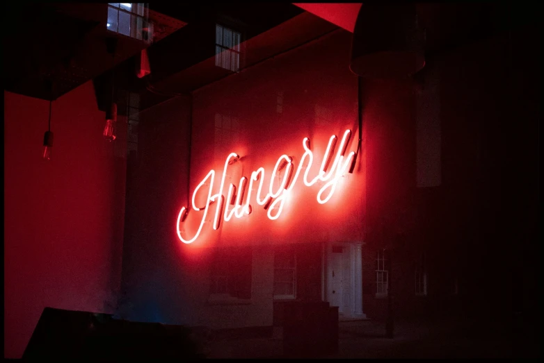 the word's are made from neon lights in red