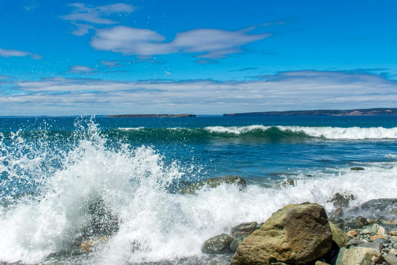 the crashing waves of a large sea wave