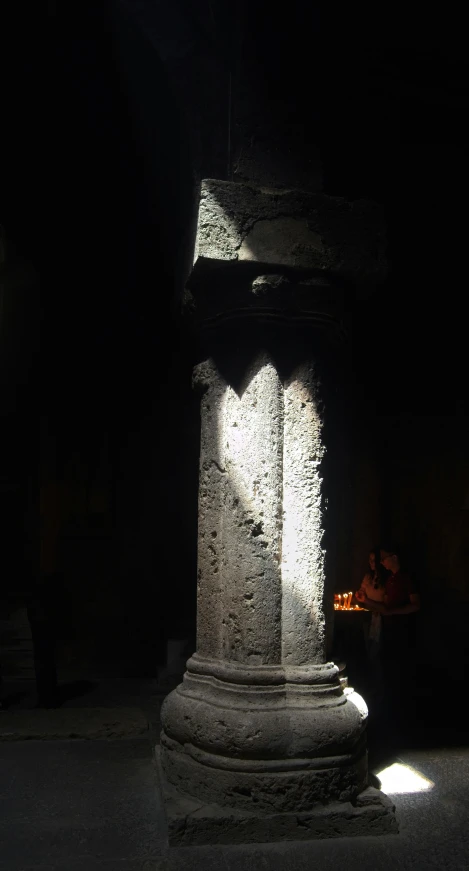 a tall, ornate pillar in the middle of a building