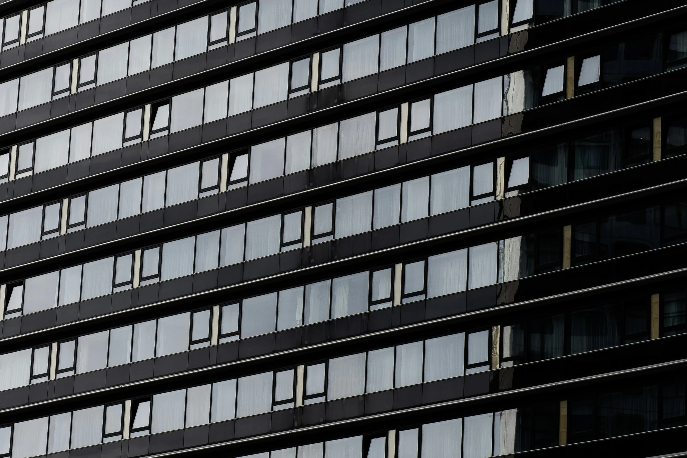 a view of the side of an office building, with windows on both sides