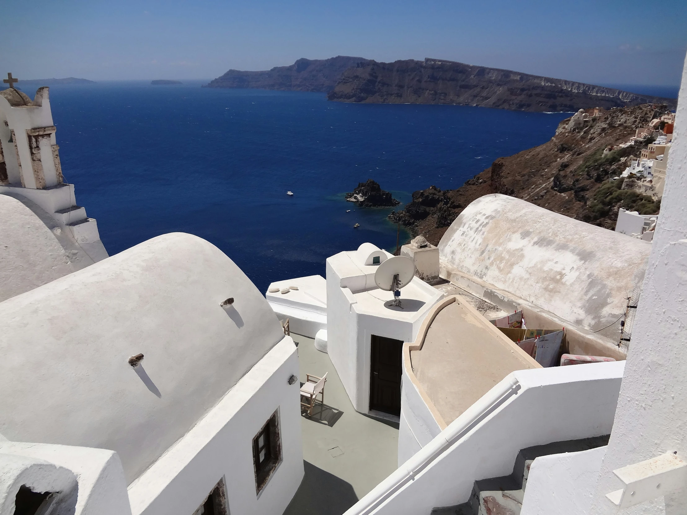 white architecture and water surrounding them on the island