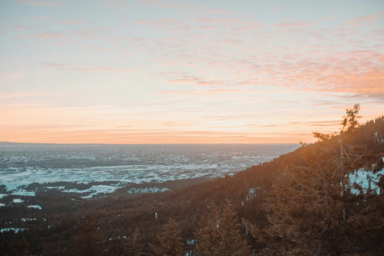 the sun rises in the mountains over a landscape