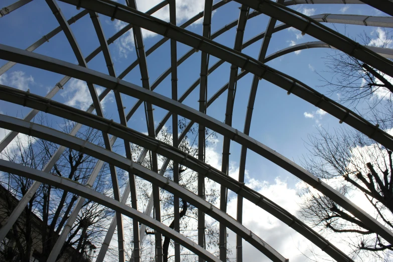 an image of the inside of a building with trees reflected in it