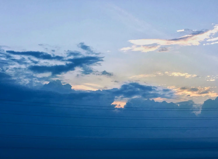 the airplane is sitting on a power line