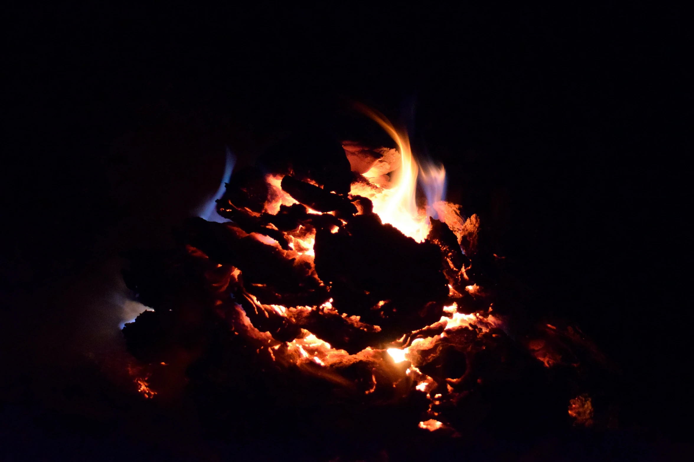 an extreme close up s of fire with the night background