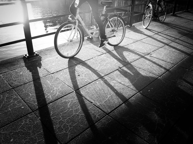 a cyclist rides his bicycle along the pier