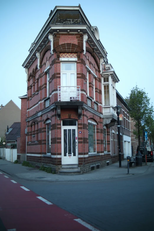 an old brick building with a large window