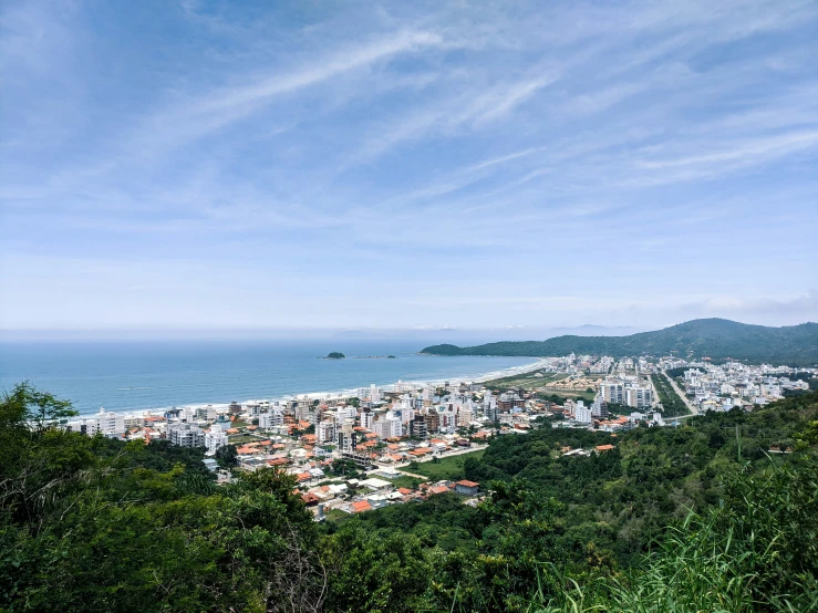 a town next to the water from a mountain