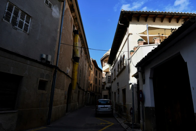 an empty alley way in an old town