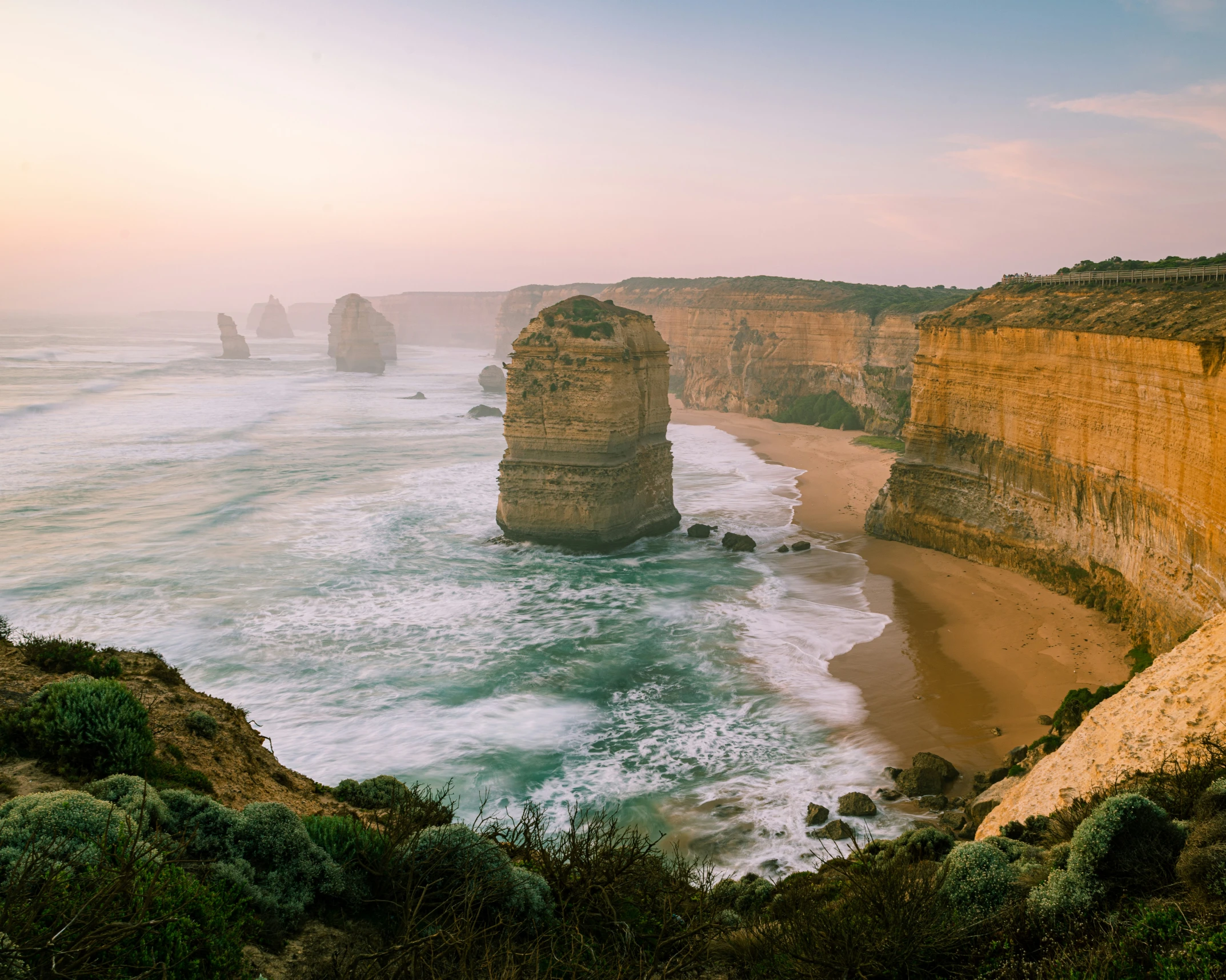 a view of some cliffs with water and land