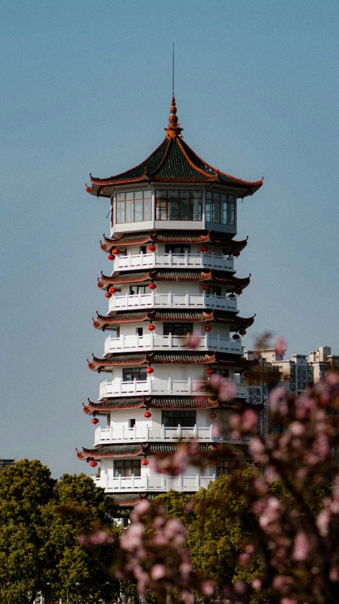 a tall tower standing in the middle of a park