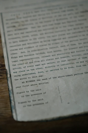 old document on table in dark room with focus on the pages