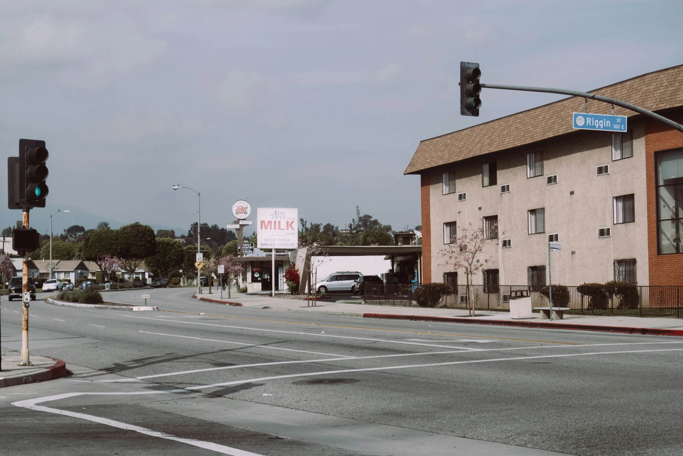 an intersection at a city street with a traffic light