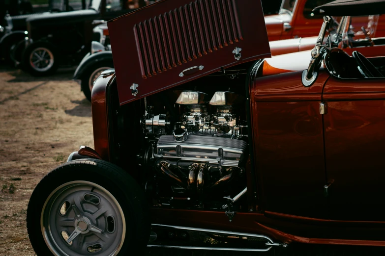 a close up of the engine on an old red car