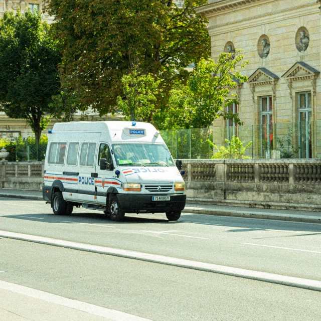 an ambulance parked on the side of a road