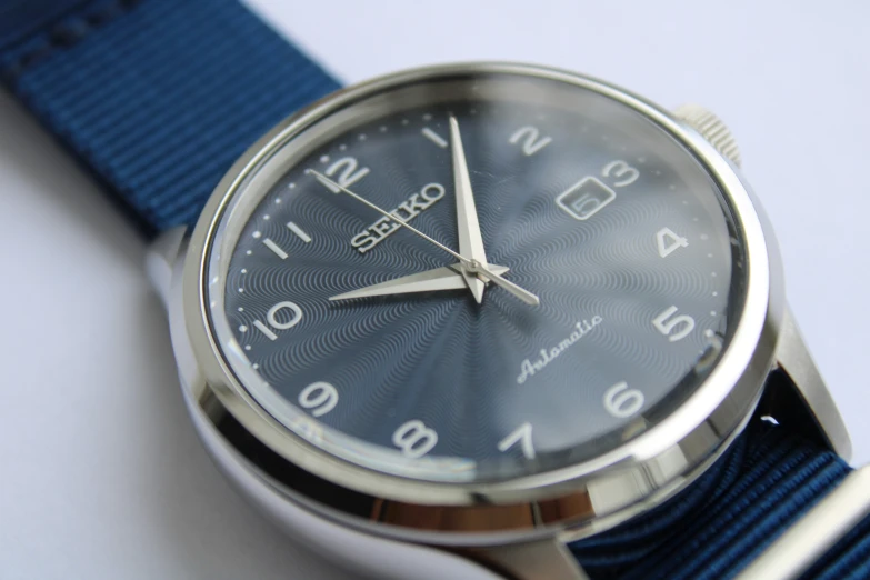 the watch has blue straps on the sides