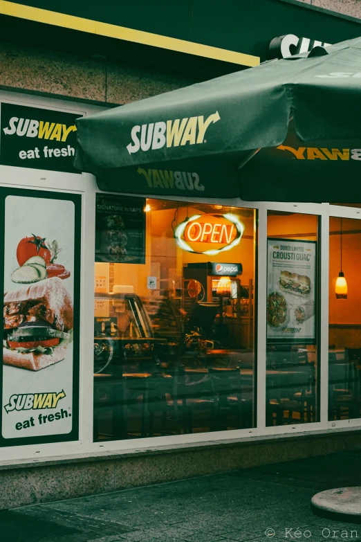 the front of subway restaurant with bright lighting