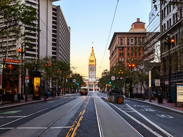 the intersection of a deserted city street at dusk