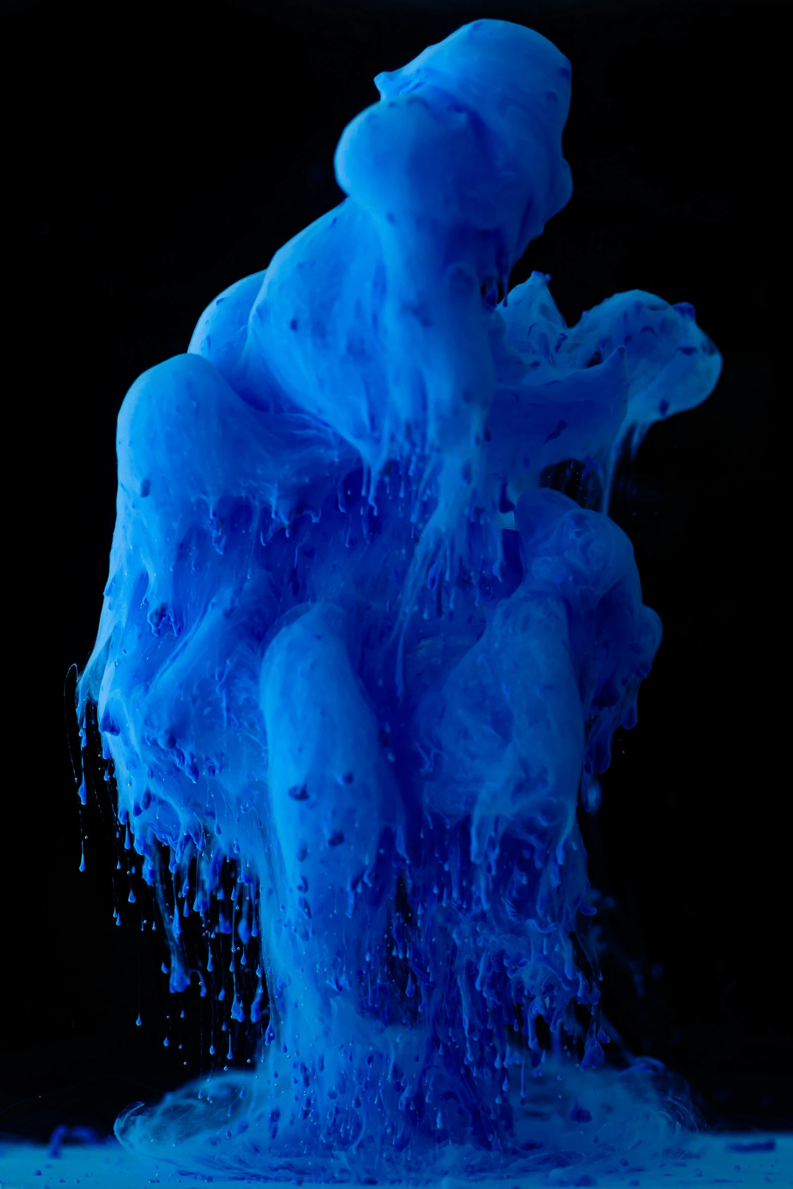 a blue substance in the air with its bubbles