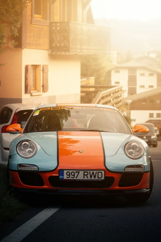 a close up of a sports car parked in the street