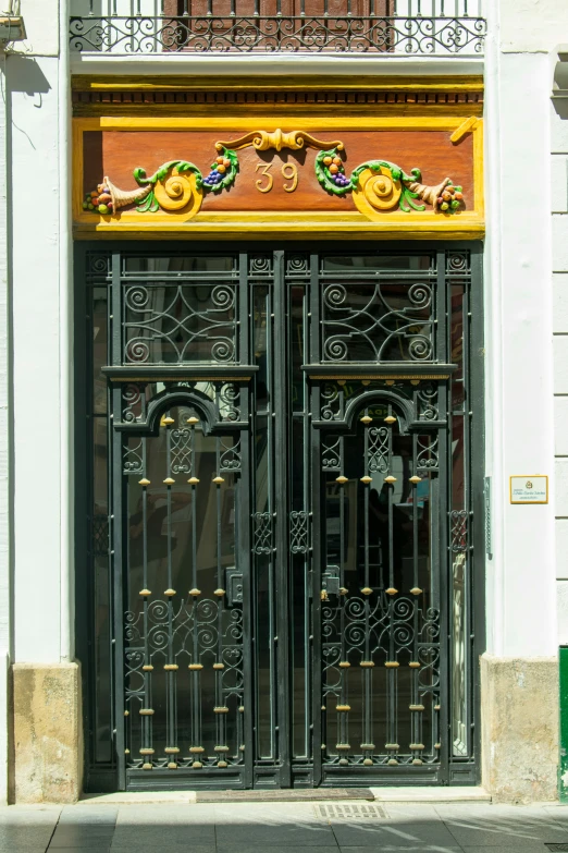 an ornately decorated entrance to a building on a city street