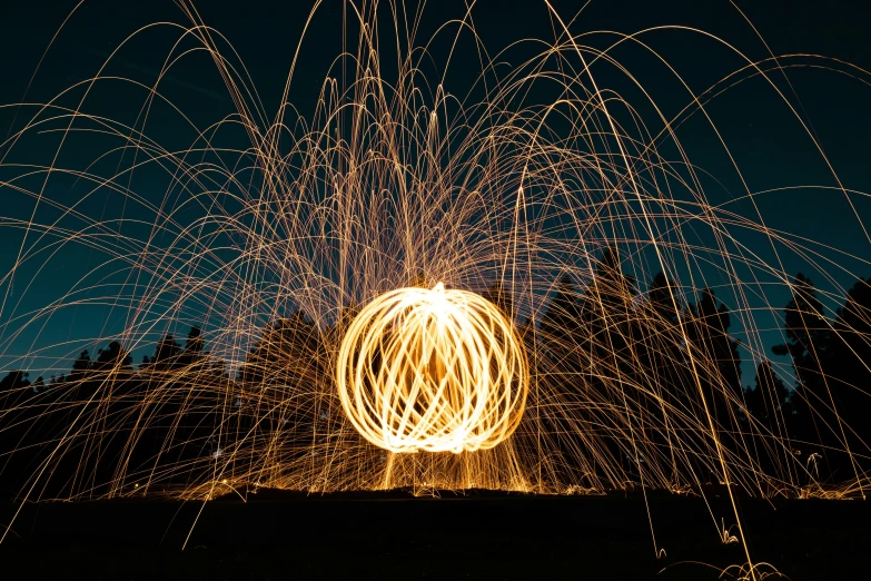 fireworks are in the sky as a person looks on