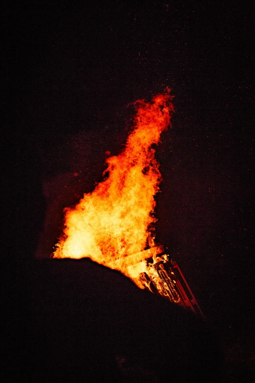 fire blazing on the top of a hill
