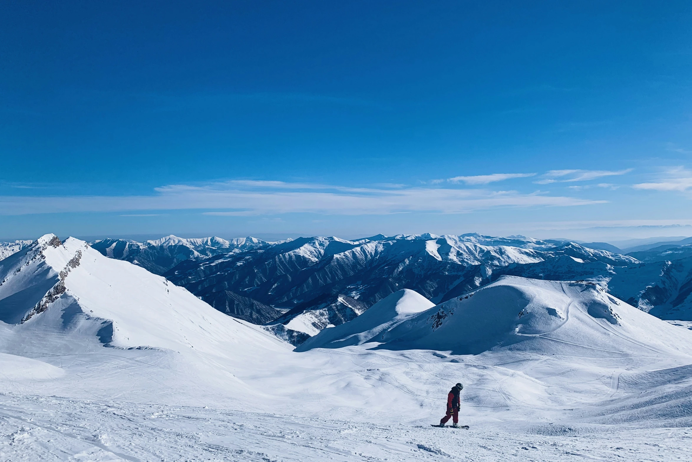 two skiers on the slopes of the mountain