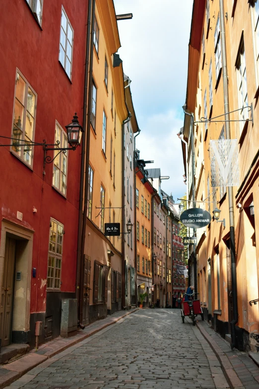 a small street with lots of houses and cars on it