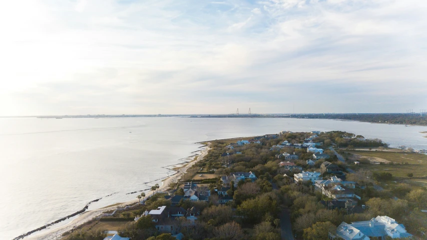 a bird's - eye view of houses along a shoreline