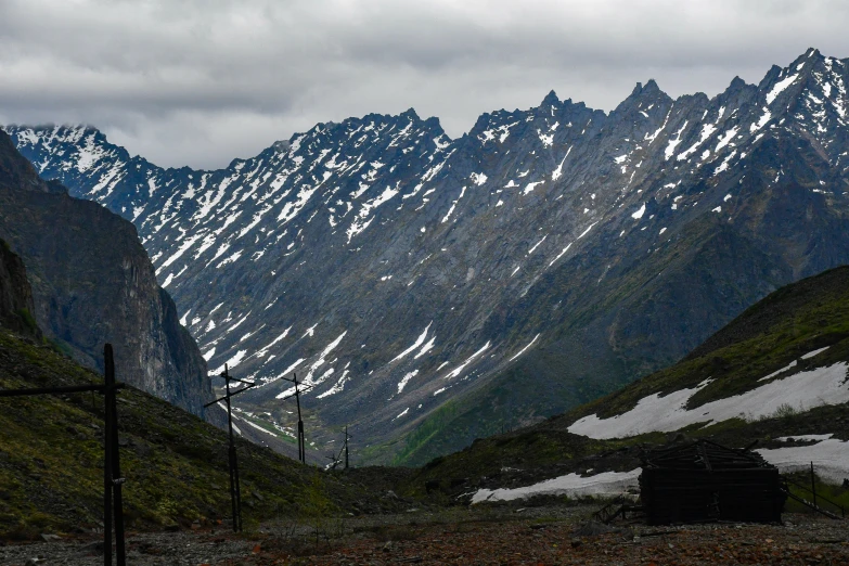 some mountains are in the distance with a snow - covered mountain